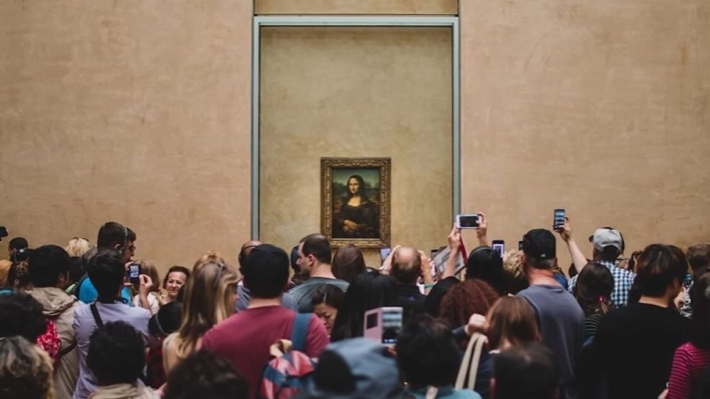 When we see it today, surrounded by crowds and protected by bulletproof glass, we're experiencing it in a context completely different from what the artist intended.