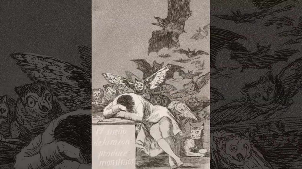 A man has fallen asleep at his desk, but it's what surrounds him that will haunt your dreams