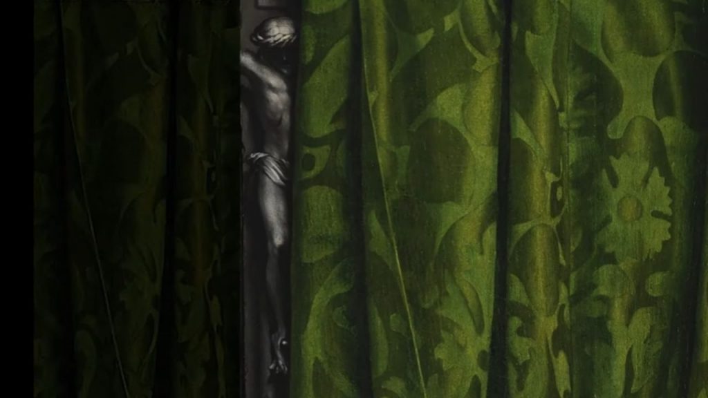Notice too the small crucifix partially hidden in the upper left corner, behind the green curtain.