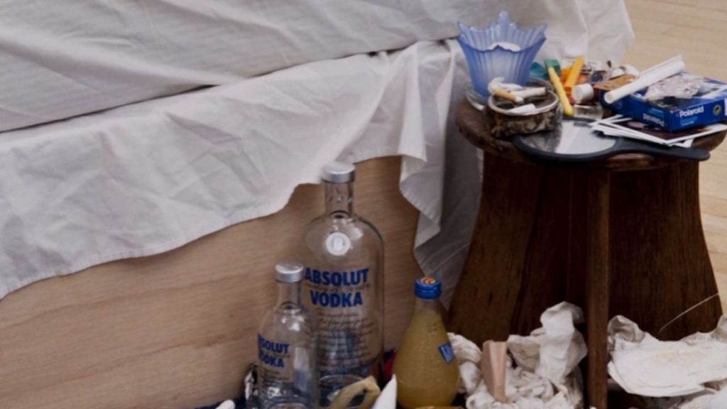 The cigarettes and alcohol speak to coping mechanisms and self-destruction. 