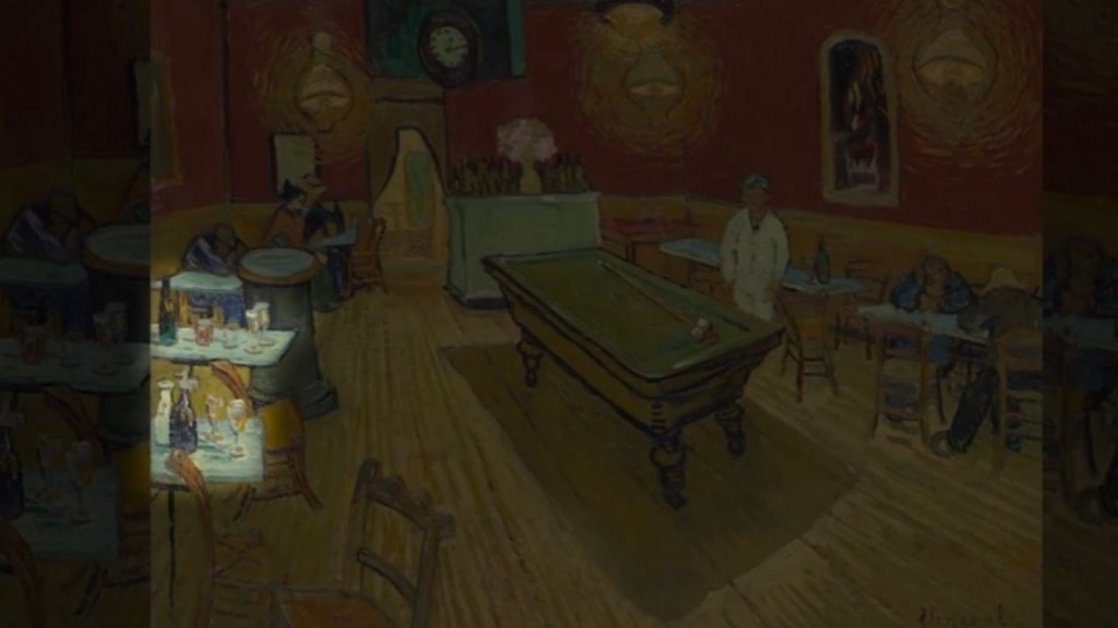 Look at the bottles on the table in the foreground.