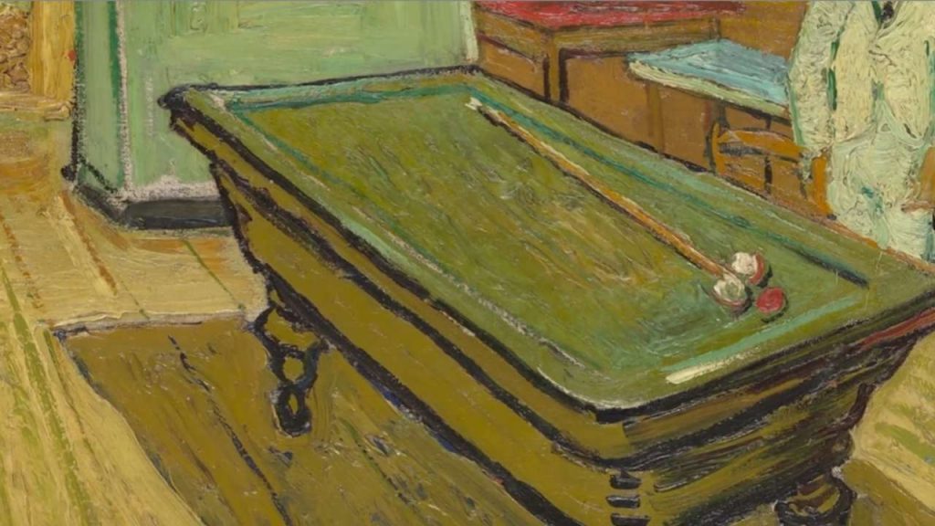 The billiard table dominates the center of the room, but no one is playing.