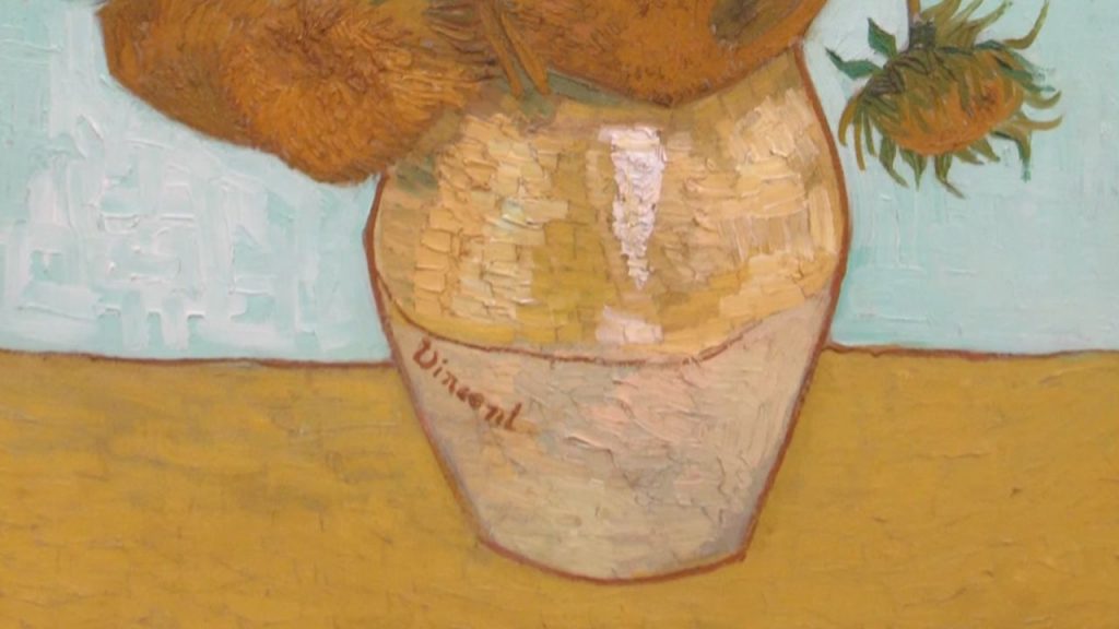 The vases holding the sunflowers deserve attention too.
